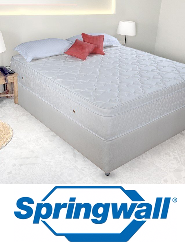 A bed with a springwall mattress on it
