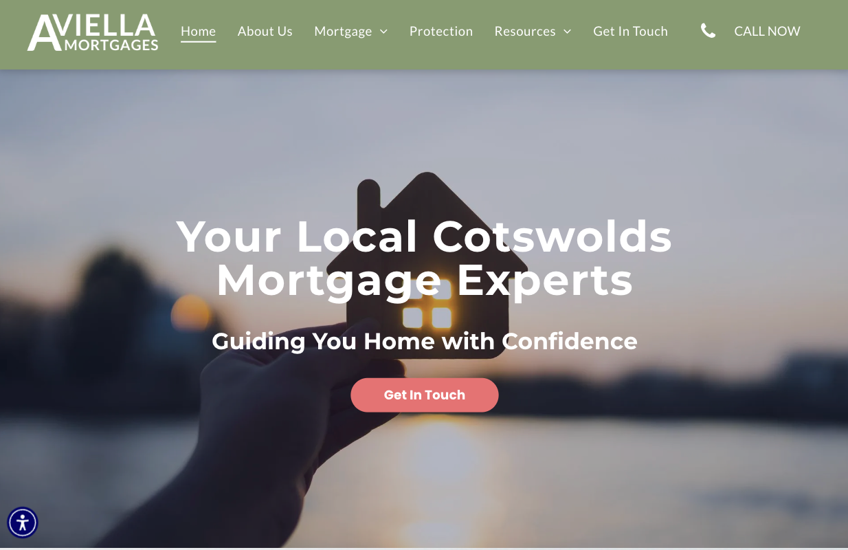 Website homepage featuring a hand holding a model of a house 