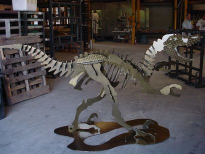 A Skeleton of a Dinosaur is on Display in a Warehouse