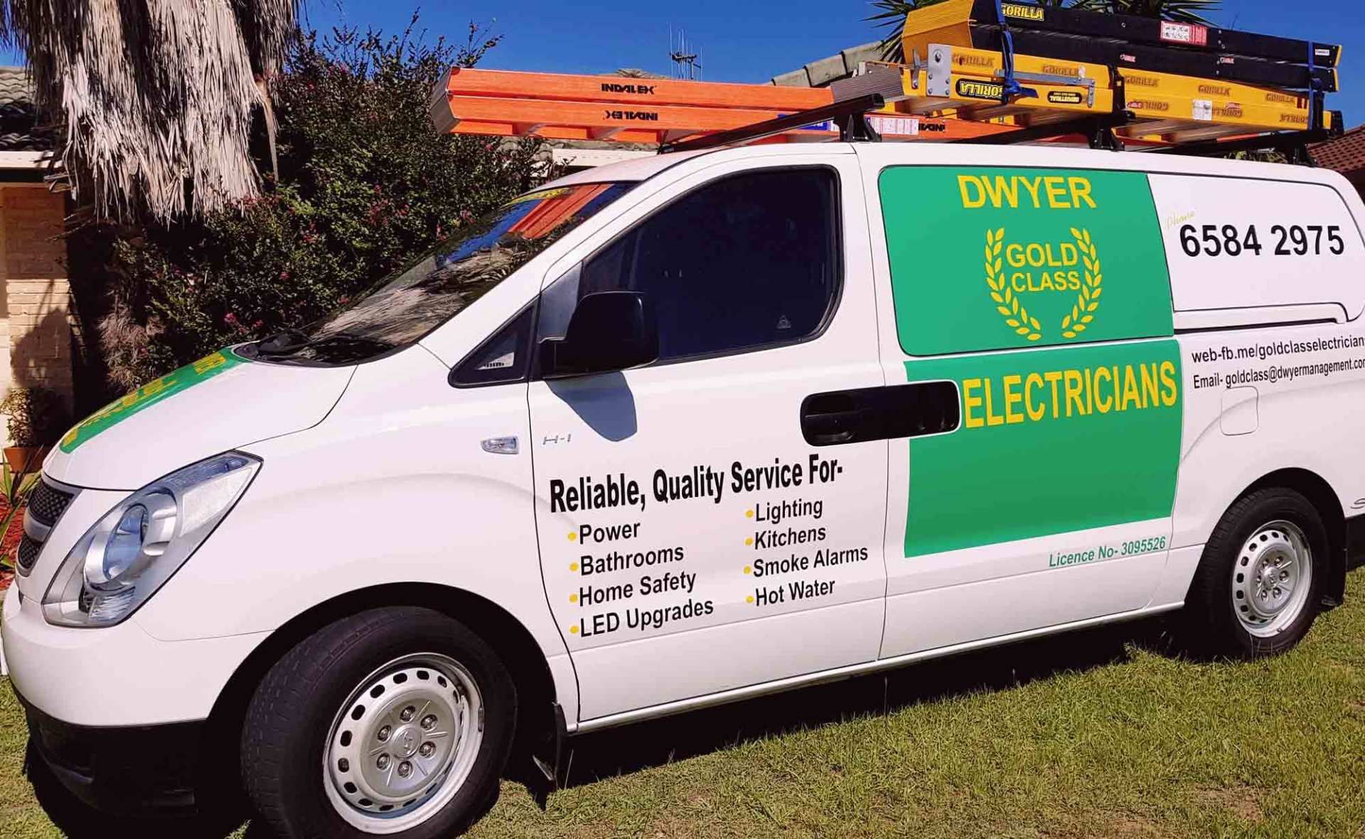 A white van with the word electricians on it
