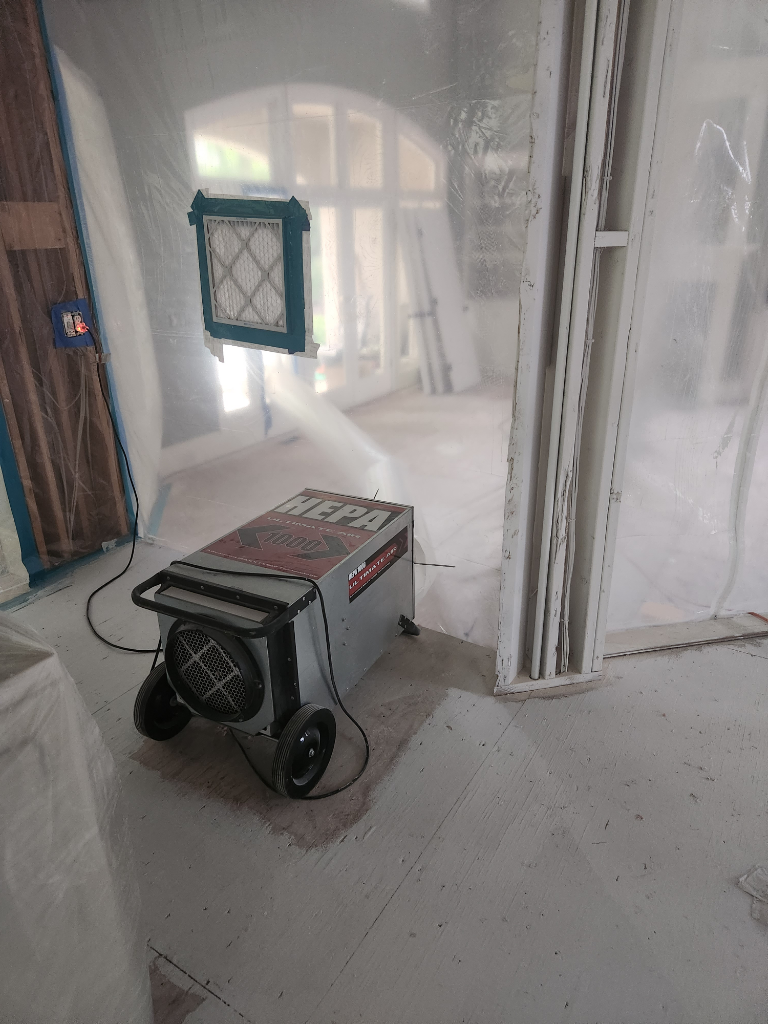 A machine is sitting on the floor in a room.