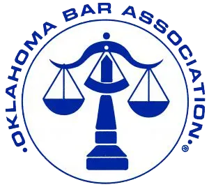 Oklahoma Bar Association logo with scales of justice in a blue circle.