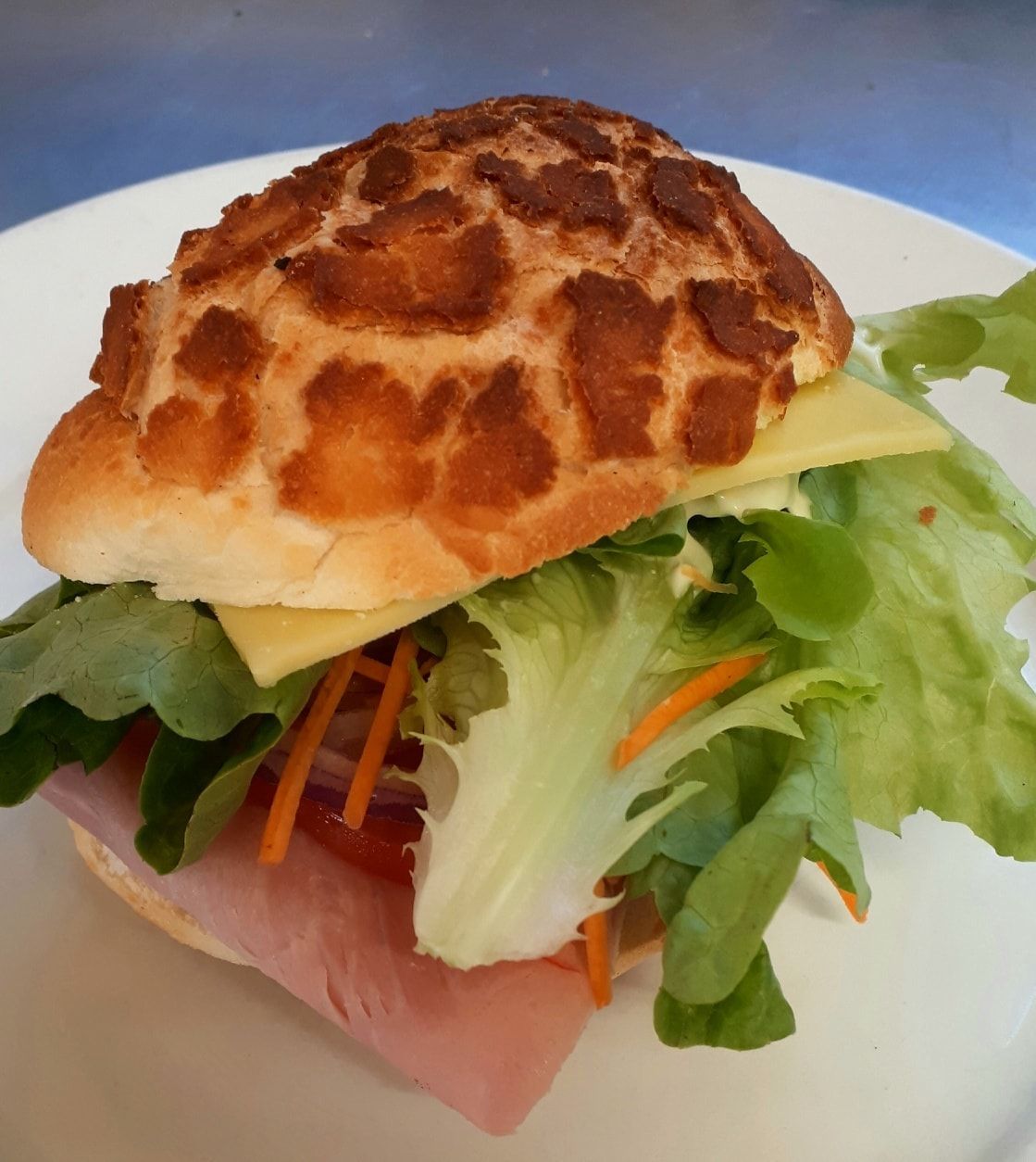 Ham, Cheese, And Veggie Sandwich On Patterned Bun — Mels Catering in Garbutt, QLD