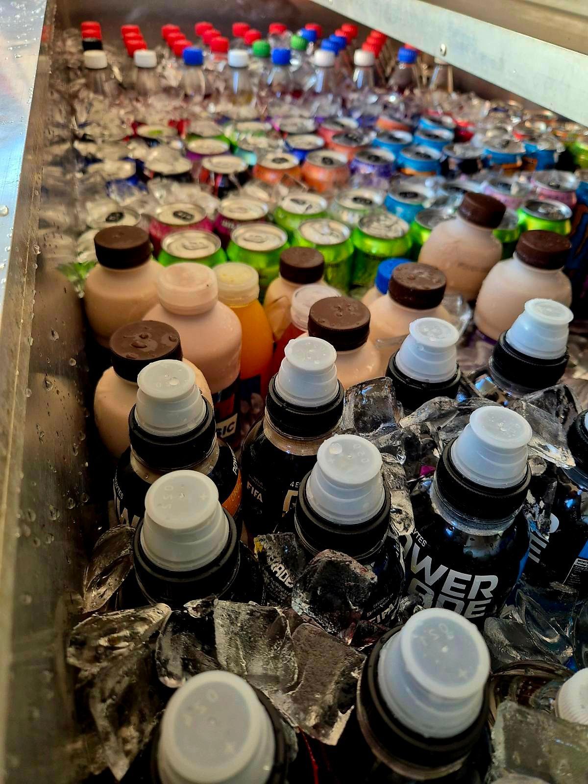 Cooler Filled With Drinks: Various Bottles and Cans Amidst Ice — Mels Catering in Garbutt, QLD