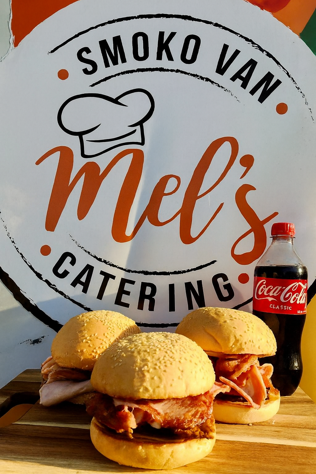Smoko Van Mel's Catering Sign With Three Bbq Sandwiches — Mels Catering in Garbutt, QLD