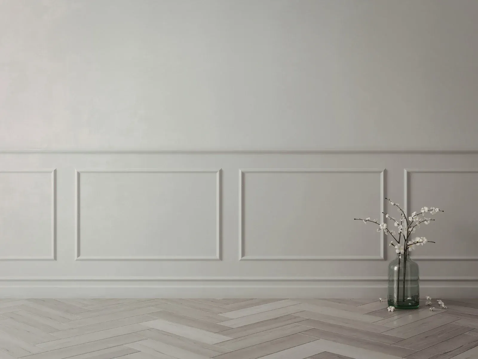 Person painting a metal frame with a gray paintbrush.