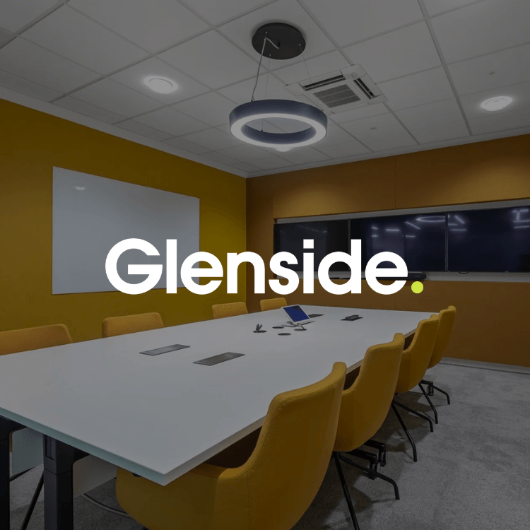 A conference room with a table and chairs and the word glenside on the wall