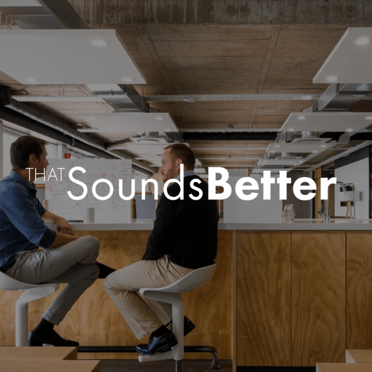 Two men are sitting at a table with the words that sounds better on the bottom