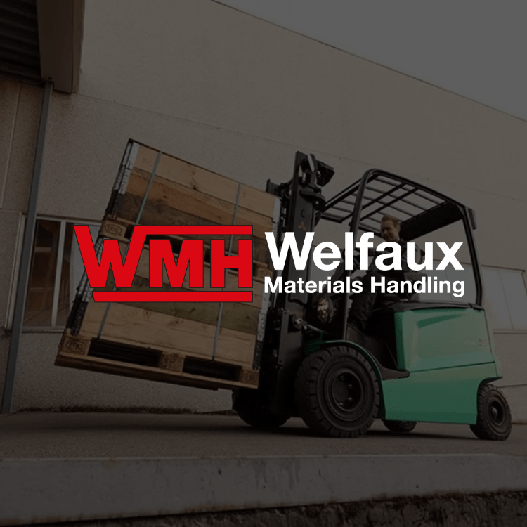 A forklift is carrying a wooden pallet with wmh welfaux materials handling written on it