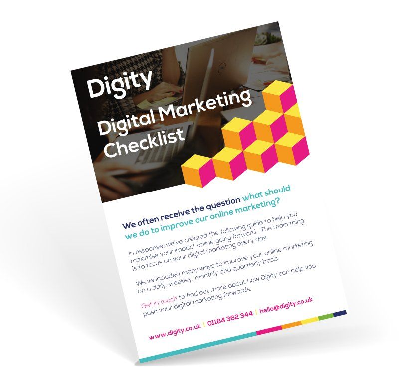 A digital marketing checklist is sitting on a white surface.