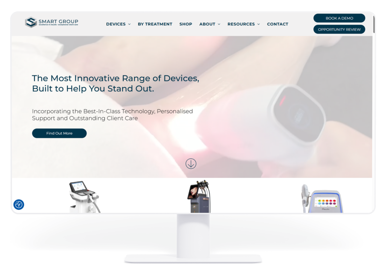 A desktop monitor displaying the homepage of the Smart Group website featuring medical aesthetic device imagery.