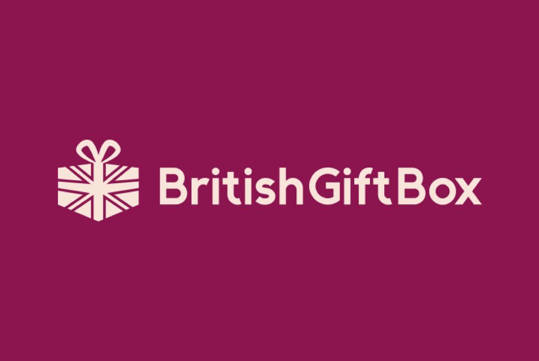the british gift box logo is on a purple background.