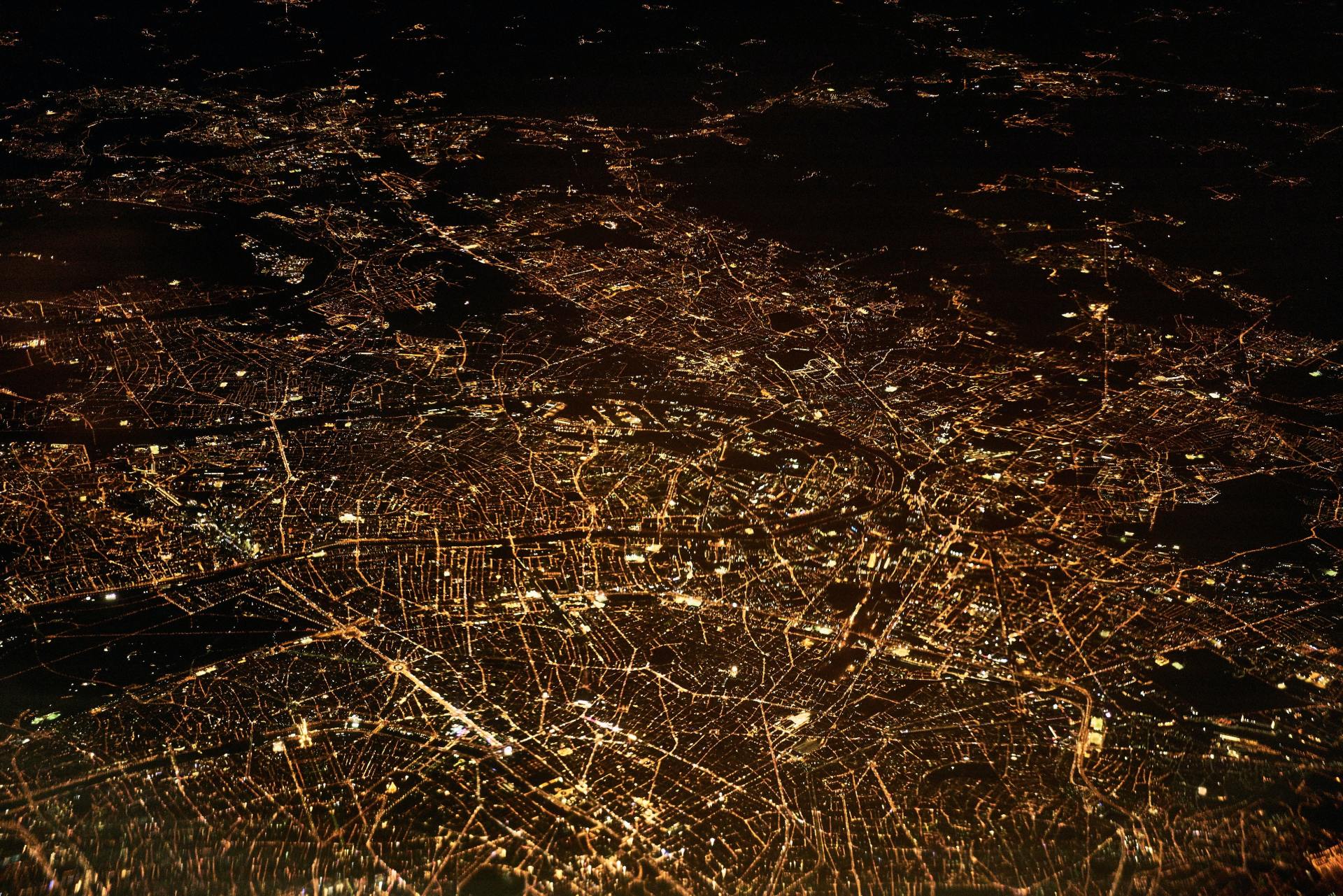 An aerial view of a city lit up at night