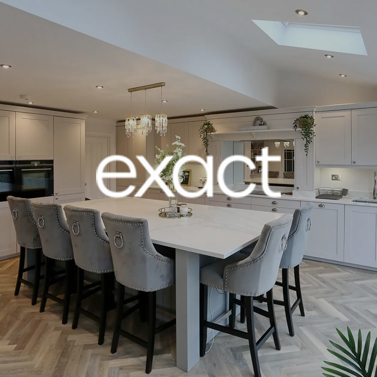 A kitchen with a table and chairs and the word exact on the bottom