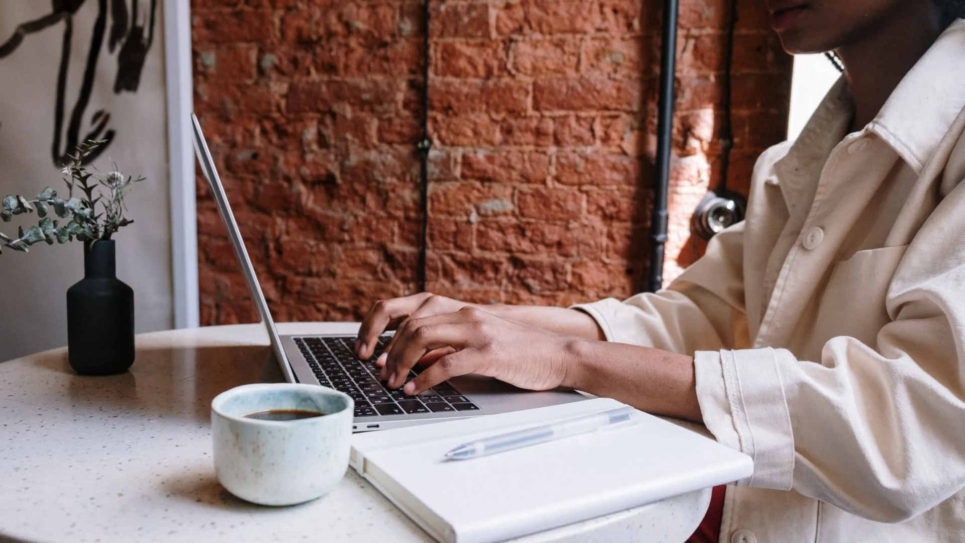A group of three cell phones sitting on top of a table.