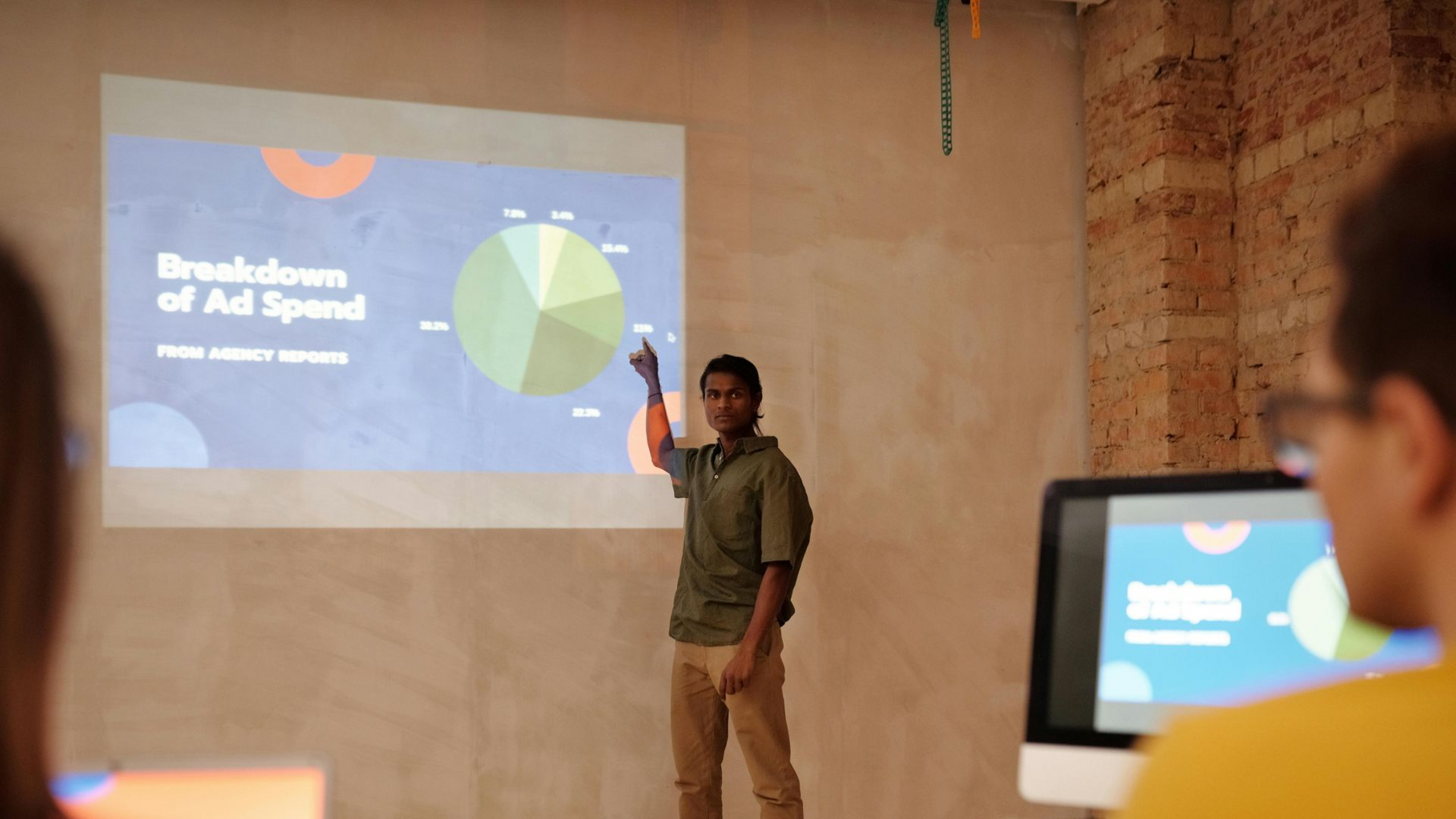 A group of three cell phones sitting on top of a table.