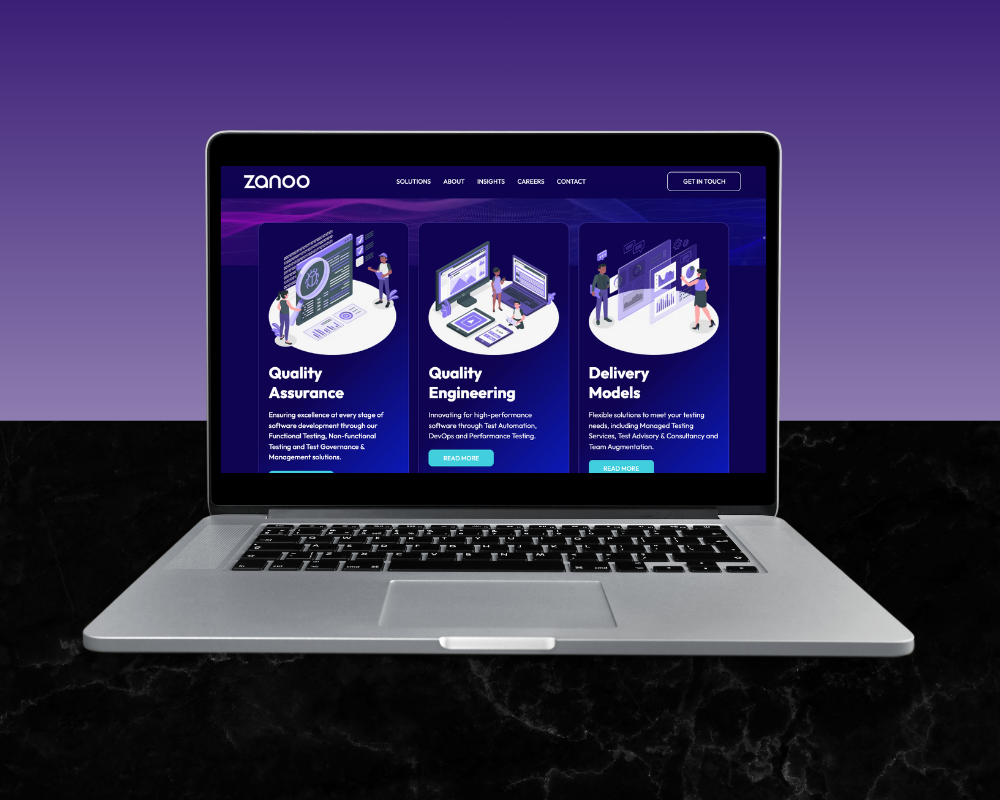 Laptop displaying website with service options: Quality Assurance, Engineering, and Delivery Models.