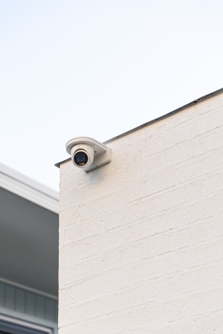 A Security Camera Mounted to the Side of a Building — Stewys Electrical and Communications In Casuarina, NSW