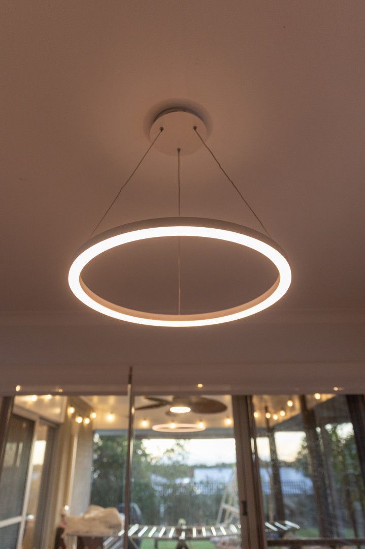 A Kitchen With Wooden Cabinets and a Counter Top — Stewys Electrical and Communications In Coolangatta, QLD