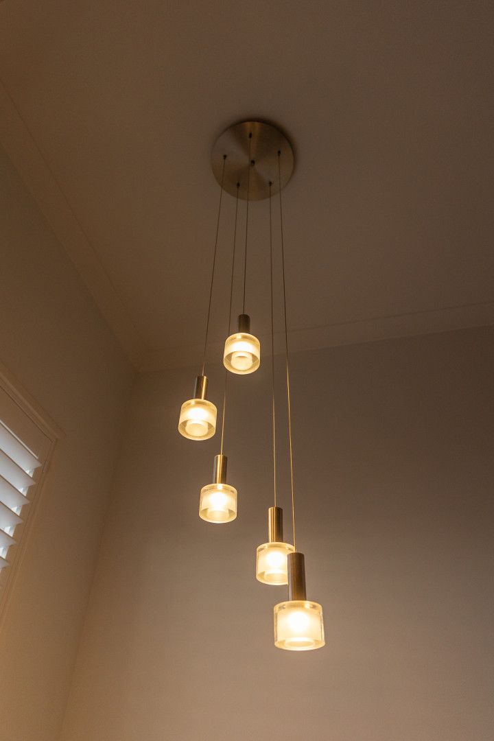 The Ceiling of a Warehouse With Lots of Lights Hanging From It — Stewys Electrical and Communications In Burleigh Heads, QLD