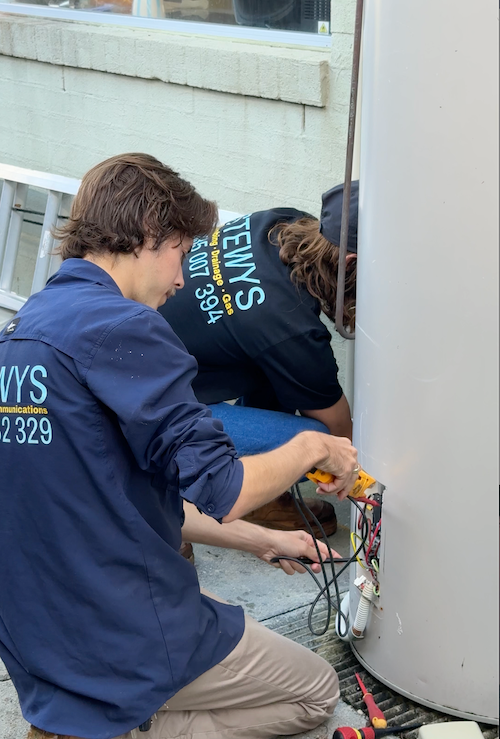 A Person is Using a Multimeter to Test a Circuit Board — Stewys in Casuarina, NSW