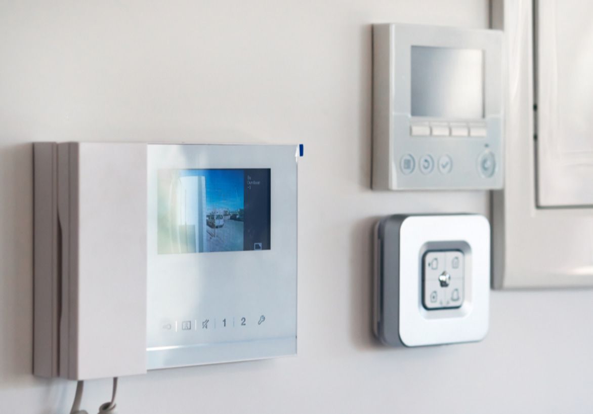 A White Telephone With a Screen on It is Hanging on a White Wall — Stewys Electrical and Communications In Casuarina, NSW