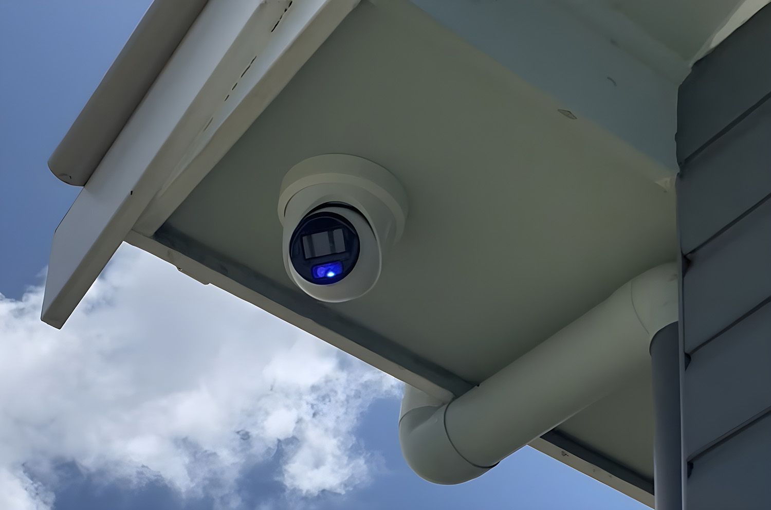 Security Camera Mounted Under The Eaves Of A Building — Stewys in Casuarina, NSW