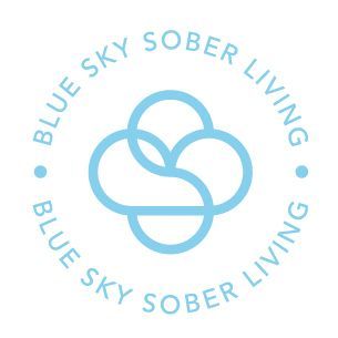 A blue sky sober living logo with a cloud in the center