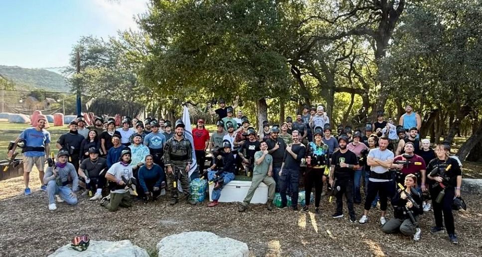 A group of women are sitting in a stadium watching a concert.