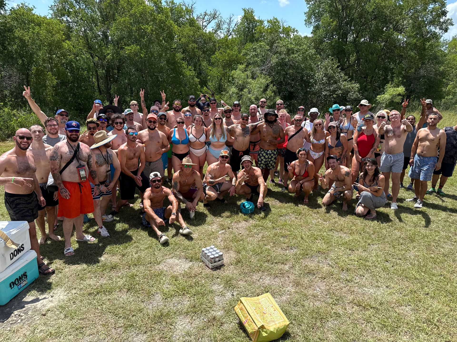 A group of people holding surfboards on a beach