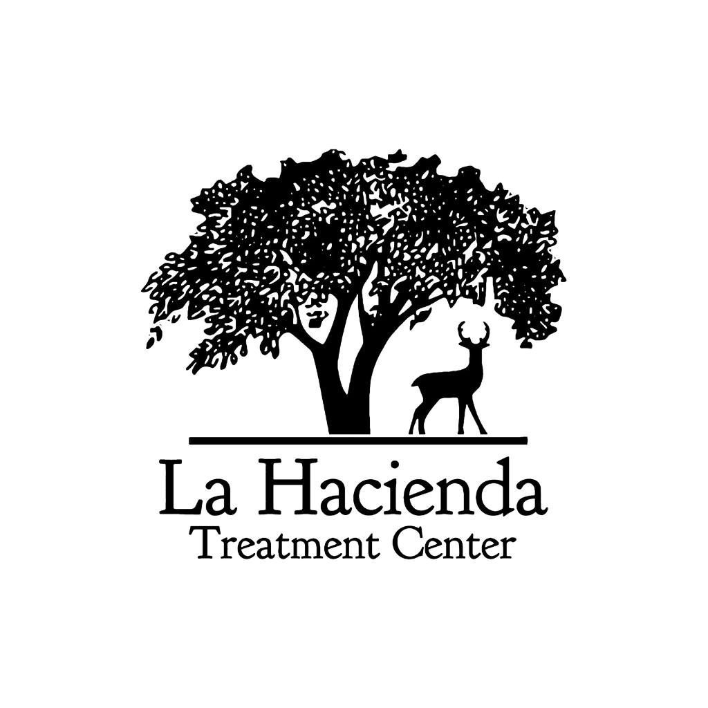 The logo for la hacienda treatment center shows a tree and a deer.