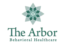 The arbor behavioral healthcare logo has a green flower on it.