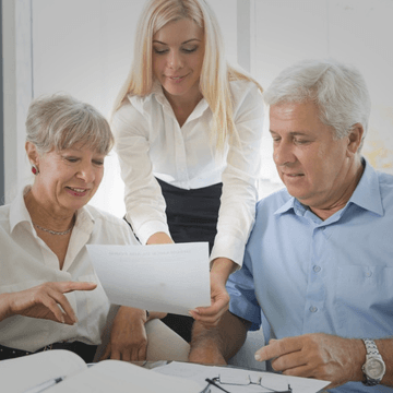 a legal consultant giving financial advice to a aged couple