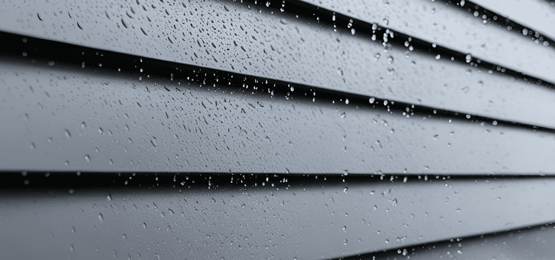 Fiber cement siding with a sealant layer keeping water out during heavy rain