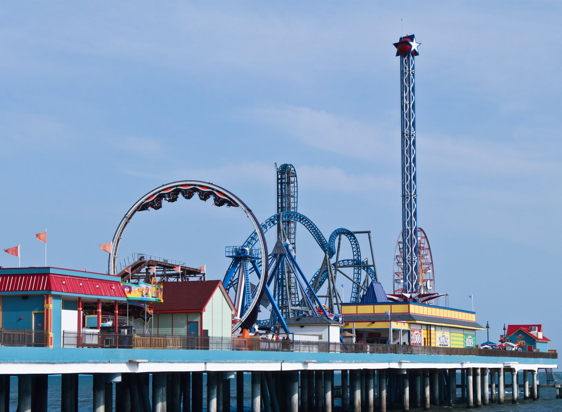 Pleasure Pier amusement park with a roller coaster and a ferris wheel