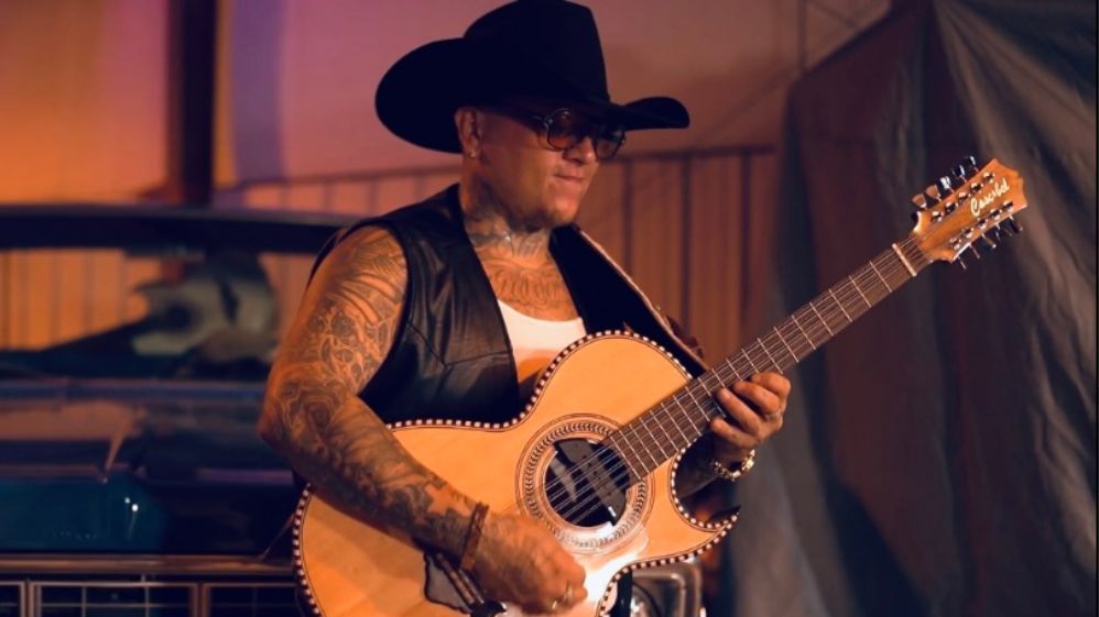 A group of men wearing cowboy hats and holding musical instruments