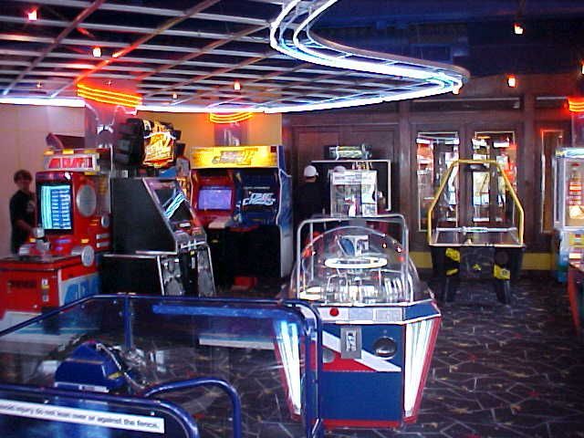 An arcade with a sign that says ' arcade ' on it