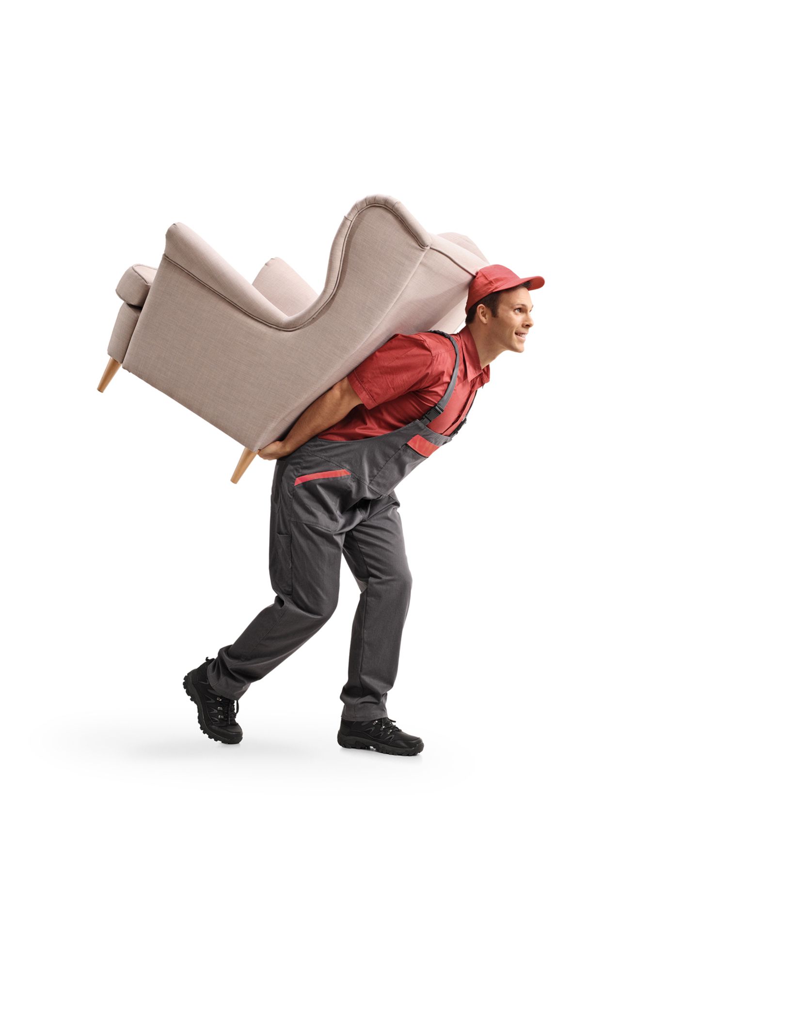 A man is carrying a chair on his back.