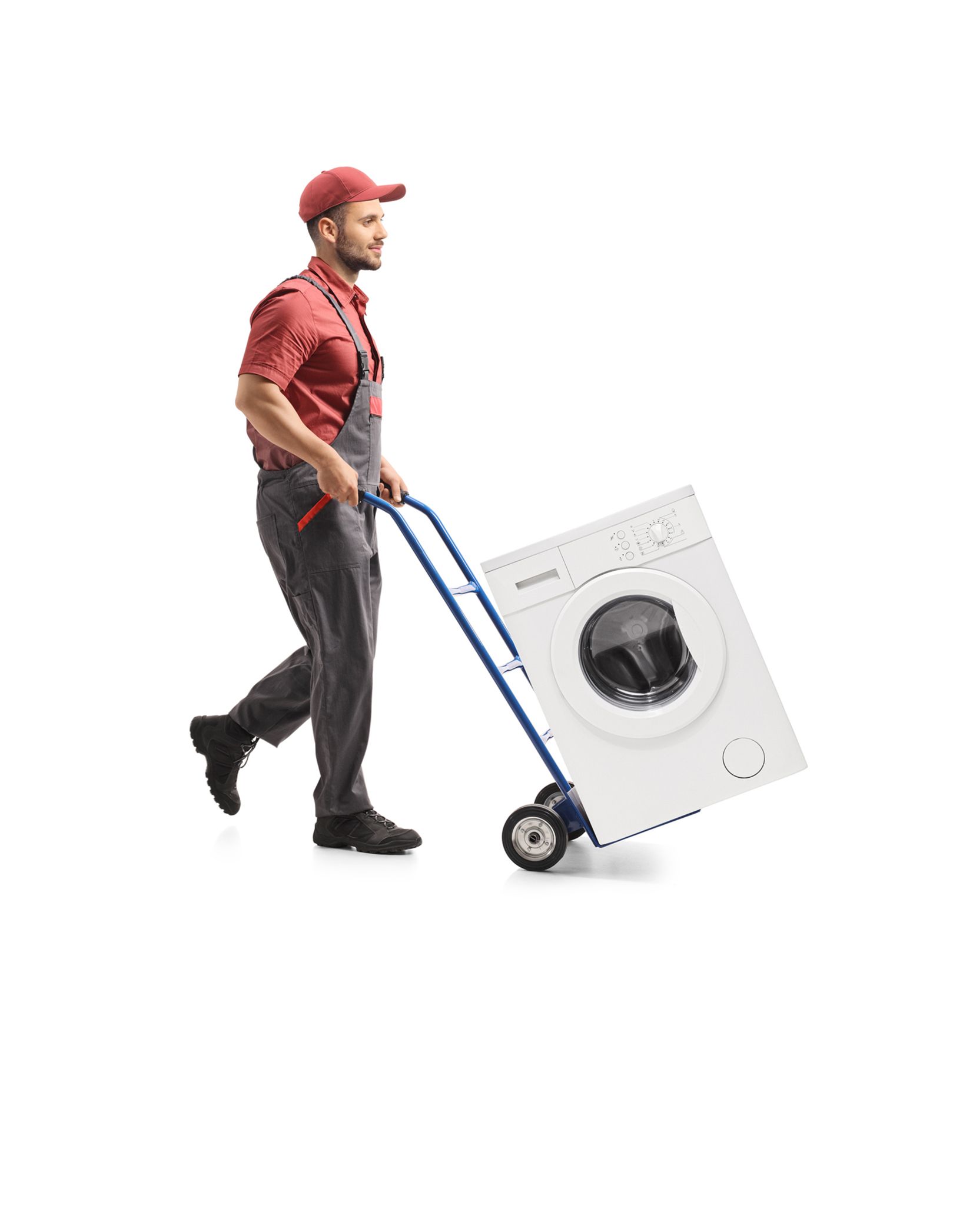 A man is pushing a washing machine on a cart.