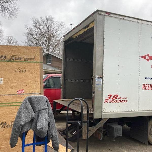 A white truck that says 38 years in business on it
