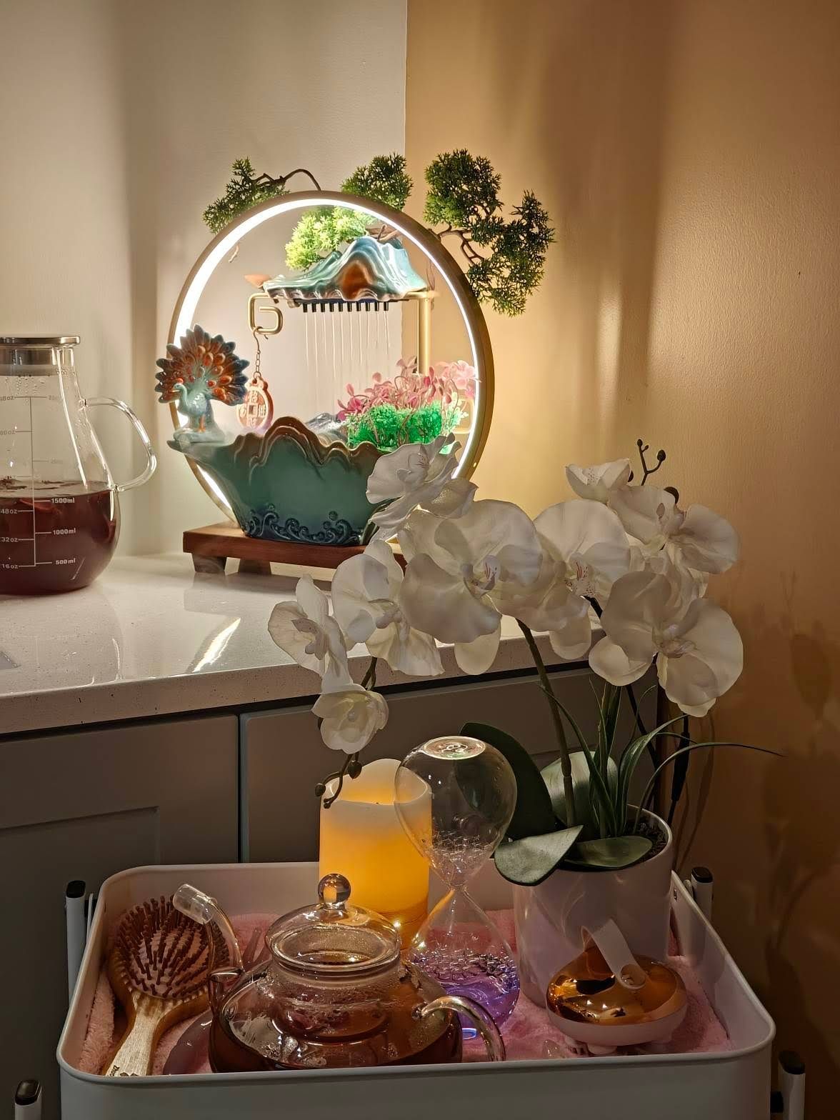 A tray with flowers and a teapot on it