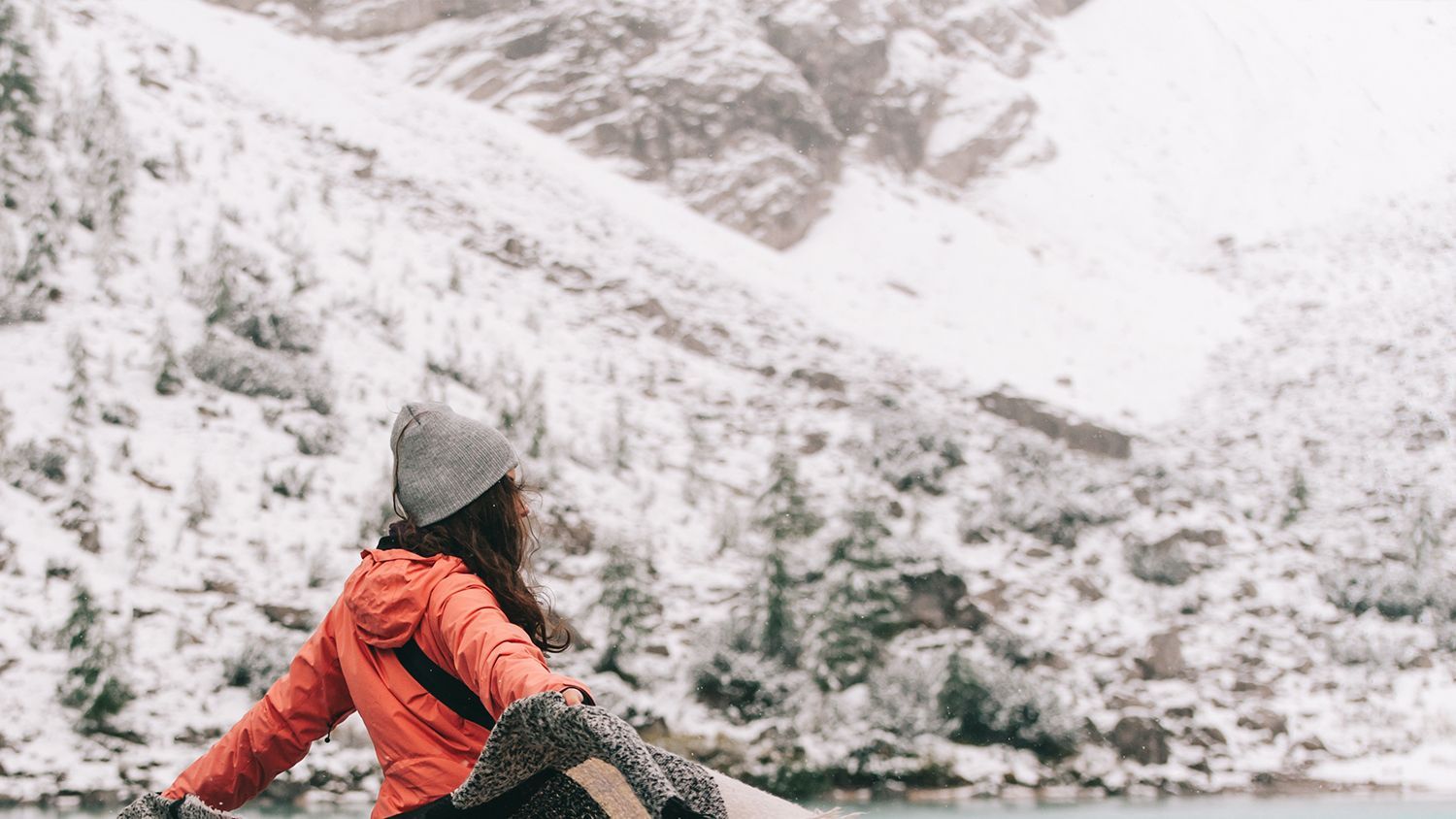 A woman is looking out over an Antarctic landscape. A woman is looking out over an Antarctic landscape.