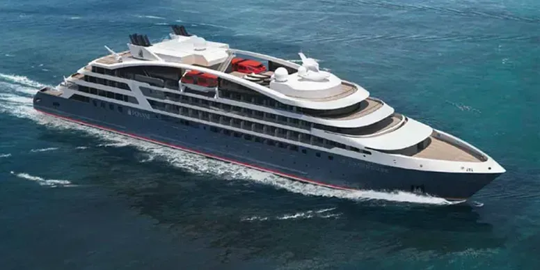 A large, dark blue cruise ship sailing on teal water.