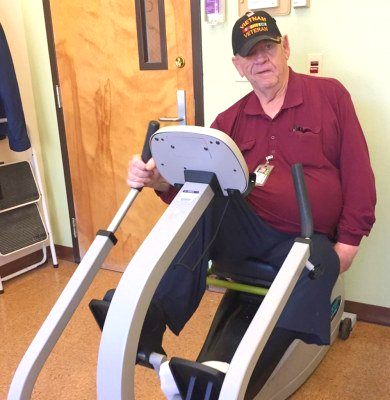 Doc — who was wounded in a land-mine explosion in Vietnam and suffered paralysis on his left side — works on an exercycle at the Yolo Adult Day Health Center.