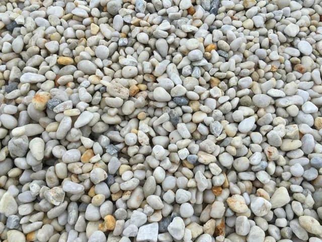 A pile of white rocks with yellow spots on them — Frost 4 Sand In West Gosford, NSW