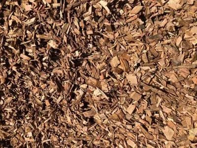 A Pile of Wood Chips is Sitting on the Ground — Frost 4 Sand In West Gosford, NSW