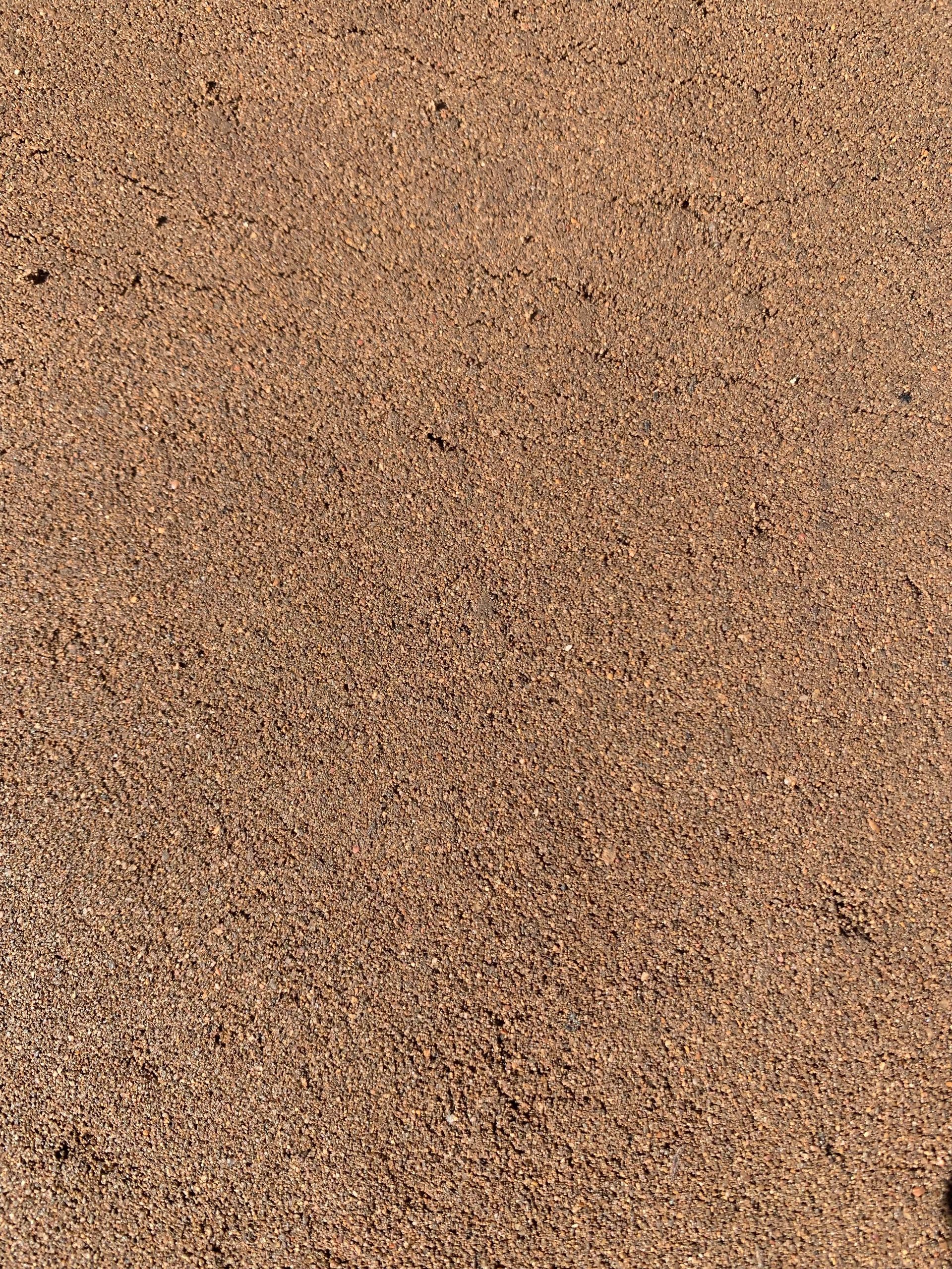 Person is Holding a Pile of Premium Screened Soil Blend — Frost 4 Sand In West Gosford, NSW