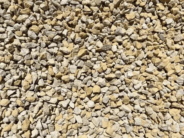 A Pile of Yellow and White Gravel is Sitting on the Ground — Frost 4 Sand In West Gosford, NSW