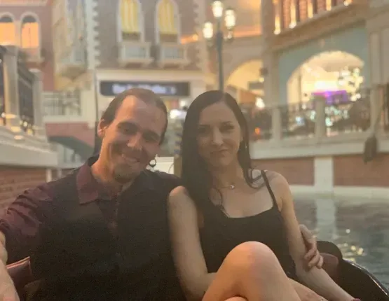 steve and louise sitting next to each other in a gondola in las vegas