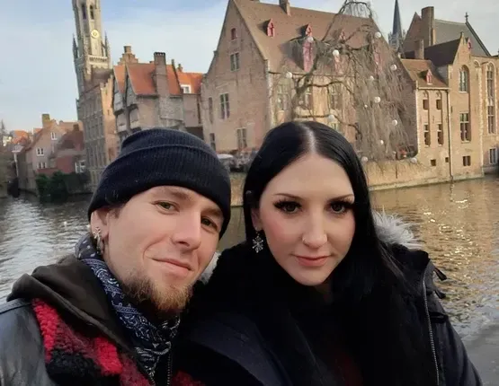 steve and louise posing for a picture in bruges, belgium